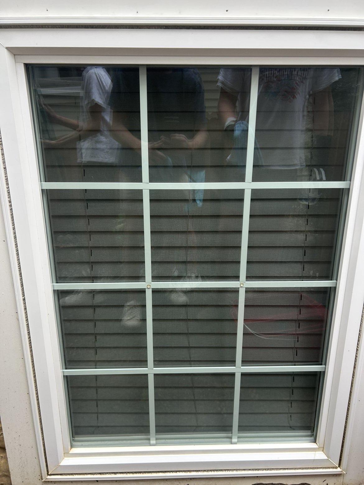 After cleaning: White framed window with blinds